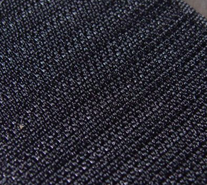 Close-up photograph showing the hook fabric backing on abadge.