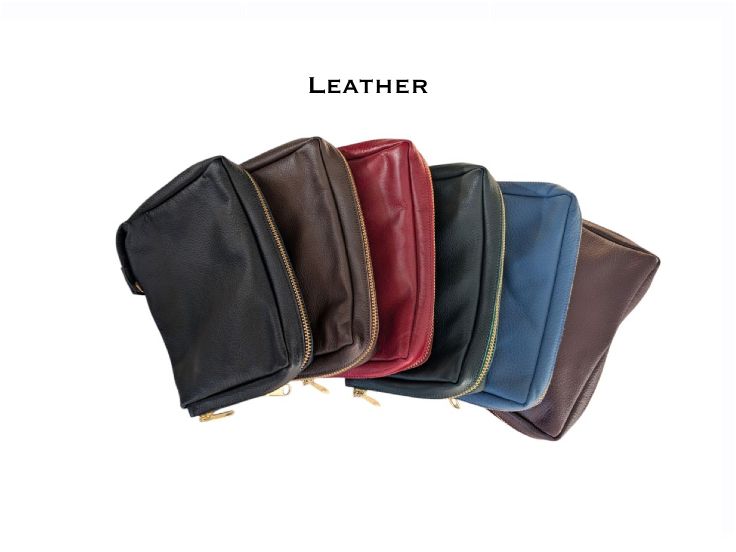 Genuine leather zipped book covers in black, brown, burgundy, blue and red, arranged in a fan shape
