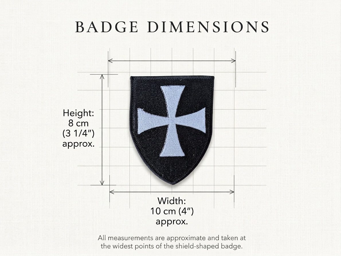 Infographic showing the dimensions of the black shield-shaped Knights Hospitaller embroidered badge, measuring approximately 10 cm x 8 cm (4 x 3 1/4 inches) at its widest points.